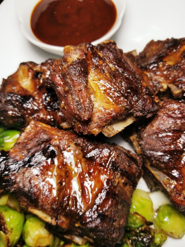 Jerk Neck Bones with Brussels Sprouts