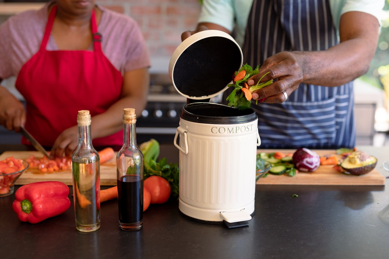 Senior couple composting at home