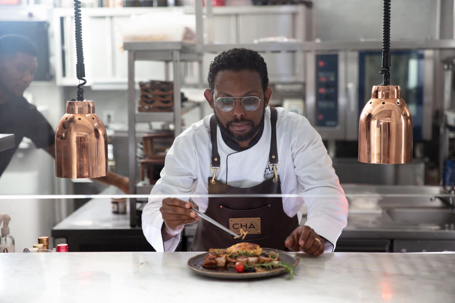  Chef Helt Araújo, founder of OVINA YETU, prepares Angolan cuisine