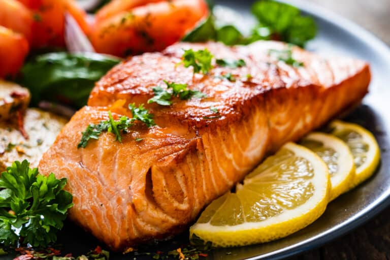 Barbecued salmon, fried potatoes and vegetables