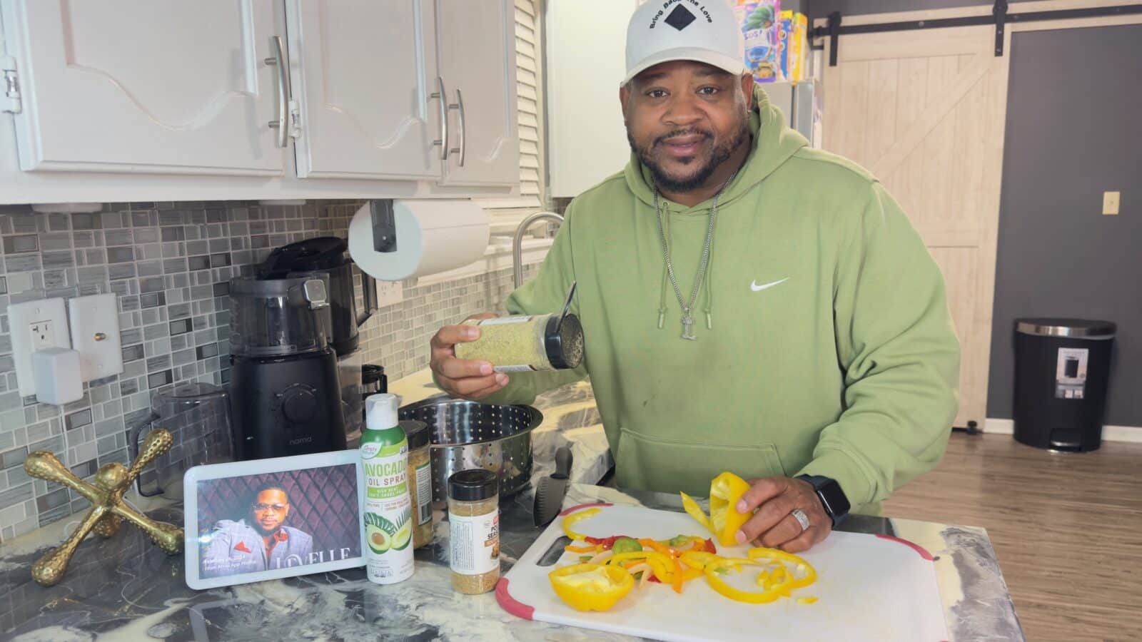 Soul singer and songwriter LeVelle seasoning veggies