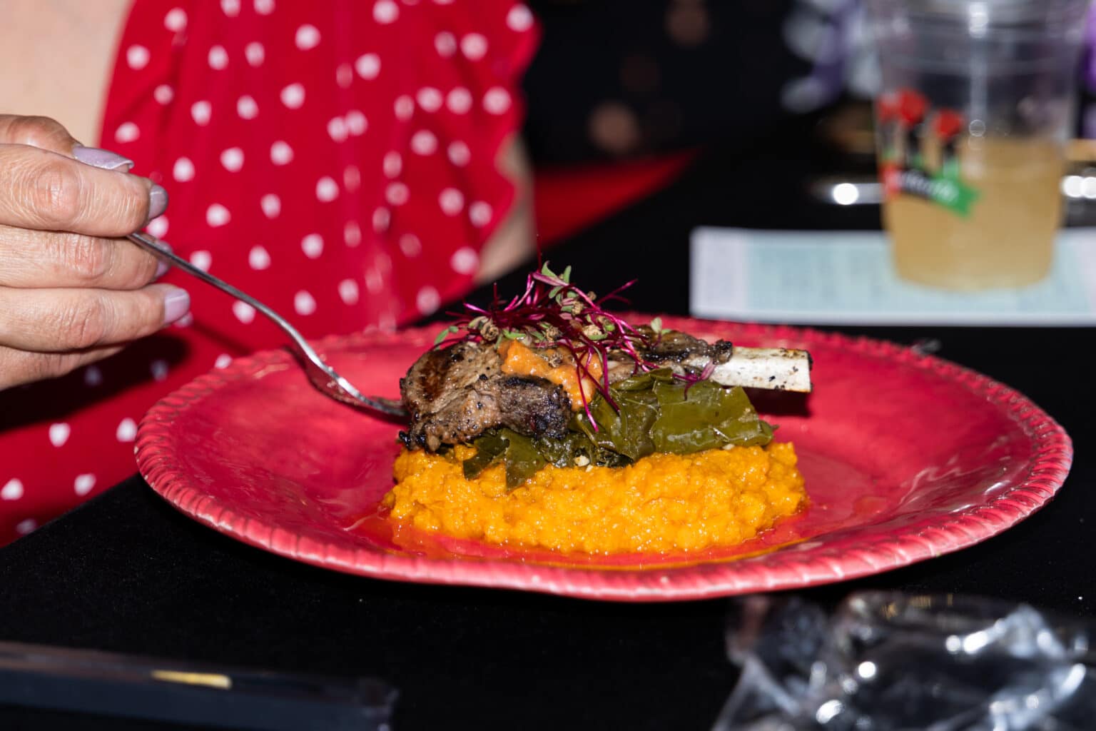 West African-spiced grilled lamb over a bed of sweet potatoes served at the 2025 Juneteenth dinner