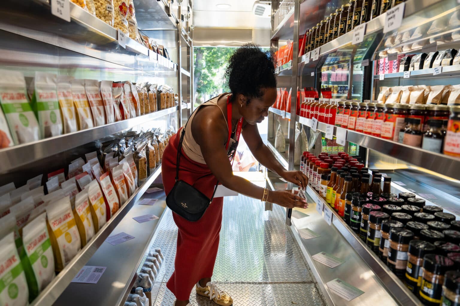  Staff member inside Prosperity Market's mobile food trailer