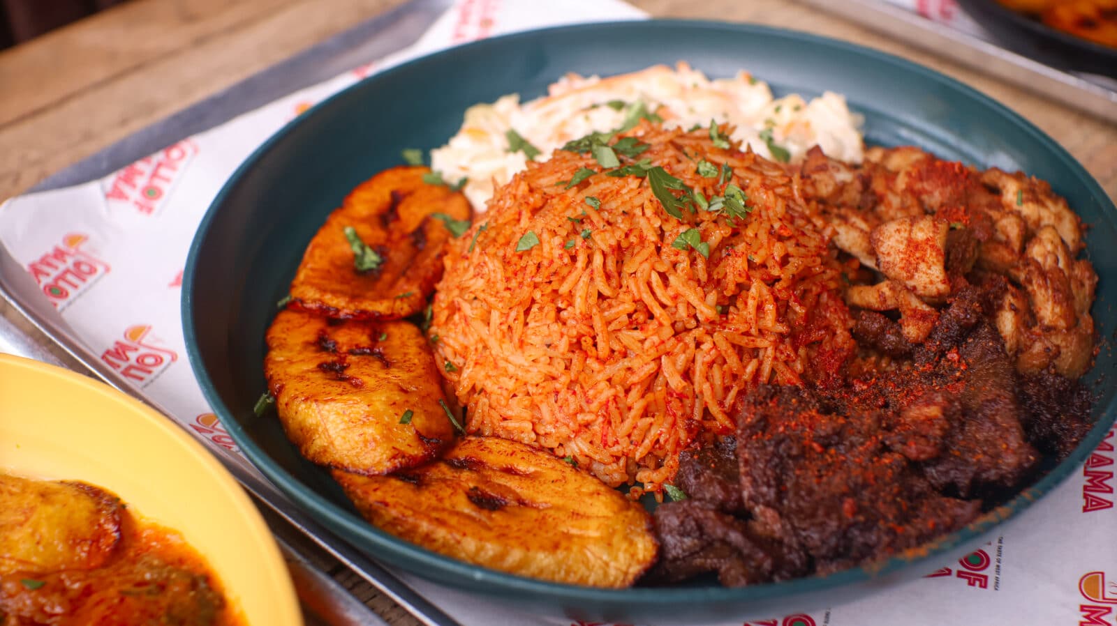 Jollof Mama - mixed meal plate of jollof rice, suya and plantains, Afro Nation Portugal