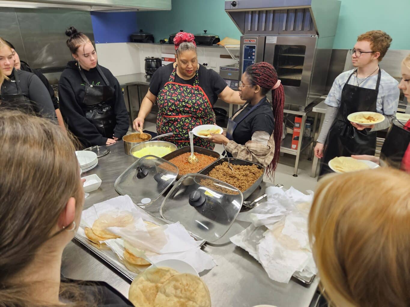 Toni Burnett-Rands teaching a cooking class with students in Tasmania