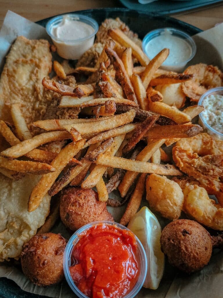 Fish fry - fried fish with fries, hushpuppies and sauces